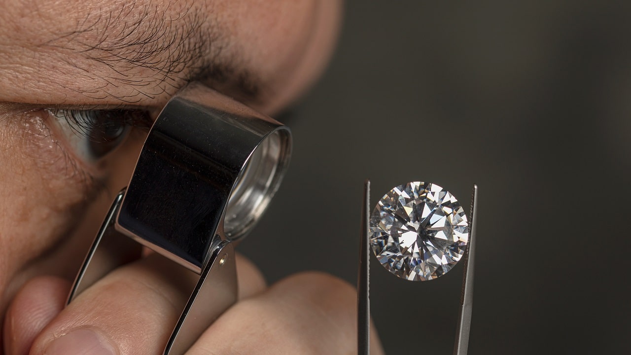 Man looking at a diamond